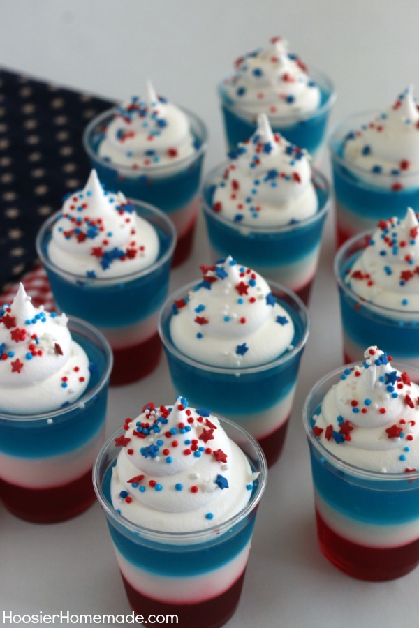 4th of July Jello Shots - make them kid friendly or add alcohol for the adult crowd! Either way they are sure to be a hit for your 4th of July Cookout! Click on the photo to grab the recipe and have FUN making these Jello Shots!