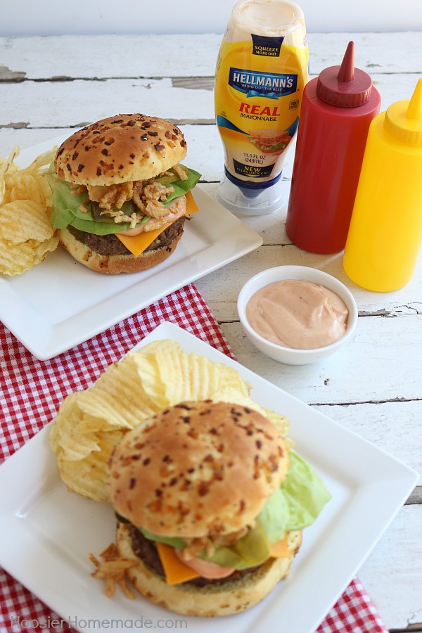 This All-American Barbecue Burger is the BEST you will ever eat! Made with a secret ingredient and piled high with barbecue/mayo sauce, cheese, lettuce and pickles all on a special onion bun! 