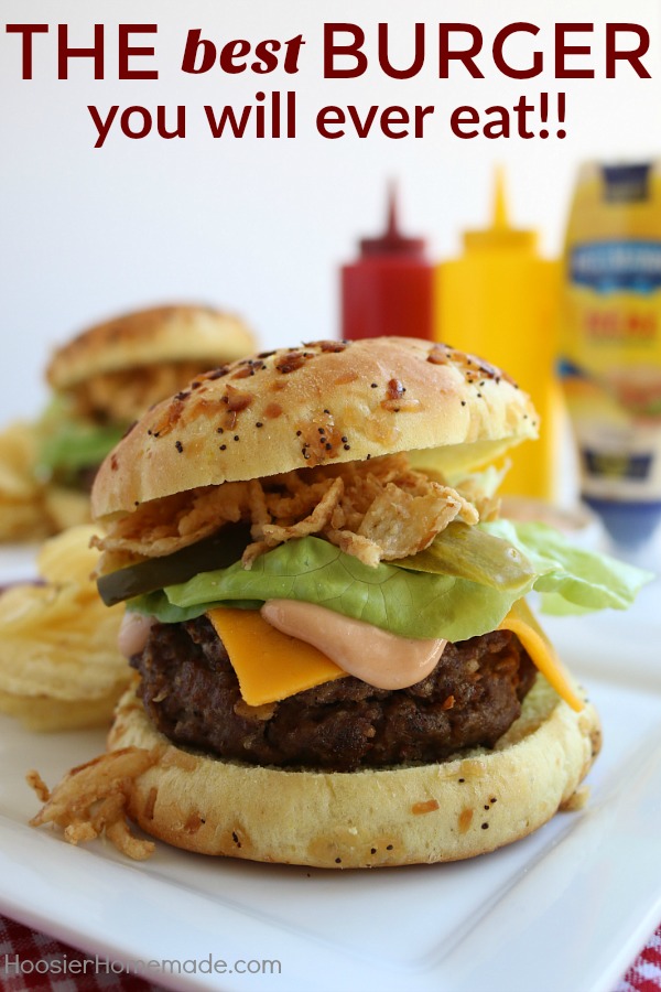 This All-American Barbecue Burger is the BEST you will ever eat! Made with a secret ingredient and piled high with barbecue/mayo sauce, cheese, lettuce and pickles all on a special onion bun! 