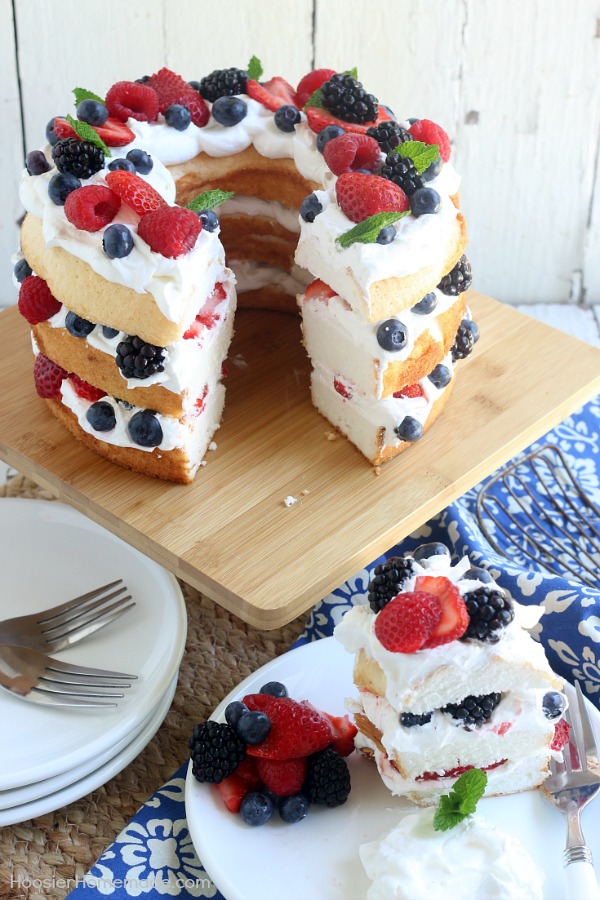 This showstopping Angel Food Cake with Berries takes ONLY 15 minutes to put together! WOW your guests with this amazing and delicious 4th of July Cake Idea or serve for any occasion! 