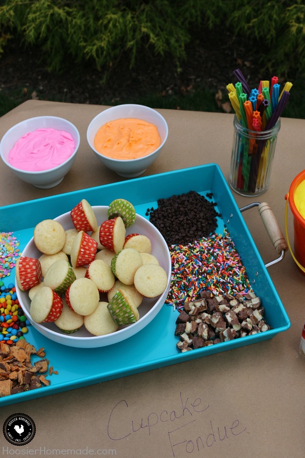 This Party Dessert Table is filled with fun for all ages! Cupcake Fondue, S'Mores Bar, No Bake Cheesecake and more! Be sure to save by pinning to your Party Board!