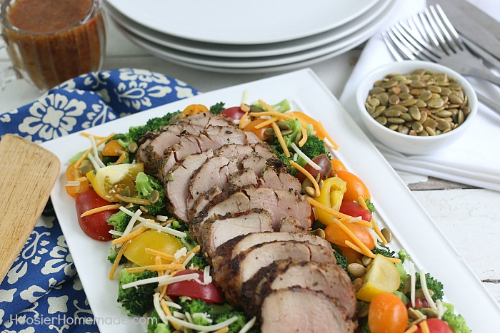 This Broccoli Tomato Salad with Pork Tenderloin is easy enough to make for a weeknight dinner yet elegant enough to serve to guests! 