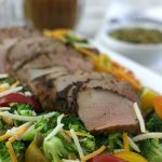 This Broccoli Tomato Salad with Pork Tenderloin is easy enough to make for a weeknight dinner yet elegant enough to serve to guests!