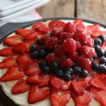 Brownie Fruit Pizza - Start with a simple brownie mix and turn it into a showstopping dessert in minutes! Cream Cheese Fruit Dip, Fruit and Apple Jelly are added to this incredibly easy dessert!