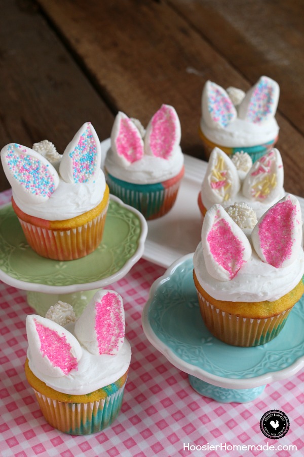 These Easy Bunny Cupcakes are perfect for Easter or Spring! They start with a 3-color cupcakes, white frosting and marshmallow bunny ears and tail. The kids will have a blast helping with these Easter Cupcakes! 