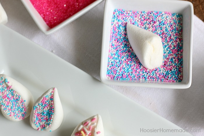 Dip marshmallow in sprinkles