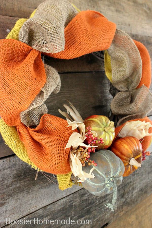 DIY FALL WREATH -- ThIS Fall Wreath takes minutes to make with just a few supplies! Brighten up your front door or inside your home with this easy to make wreath!