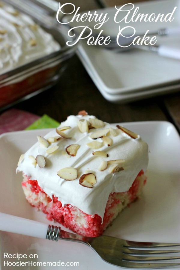 The perfect Spring dessert! Cherry Almond Poke Cake - white cake "poked" with cherry jello, flavored with almond extract and topped with a fluffy frosting! Pin to your Recipe Board!