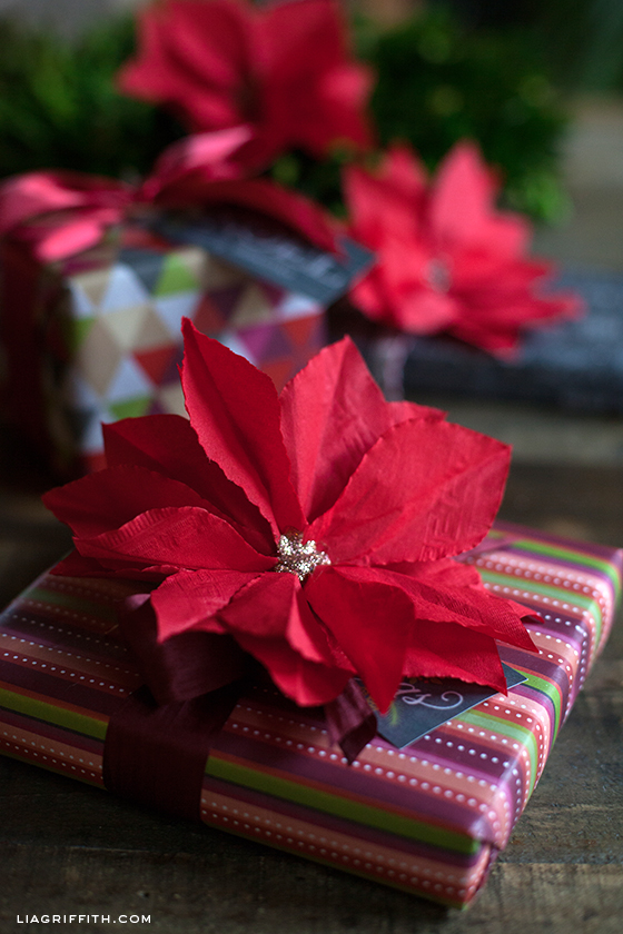 Learn to make this beautiful Paper Poinsettia from a cocktail napkin! Perfect for decoration or on top of gifts! Pin to your Christmas Board!