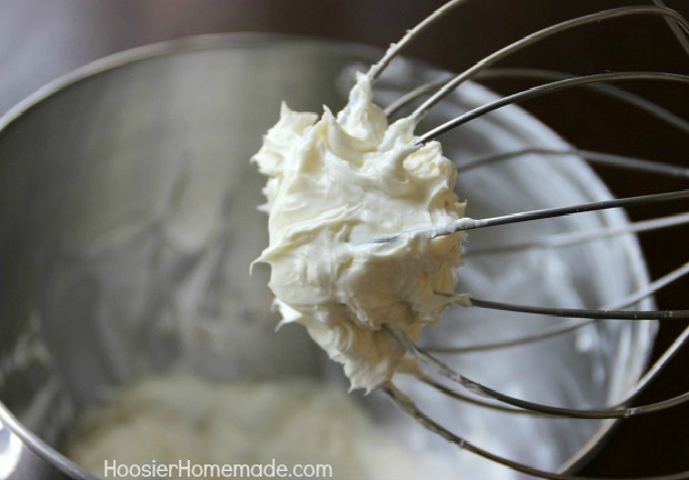 Whip cream cheese until smooth.