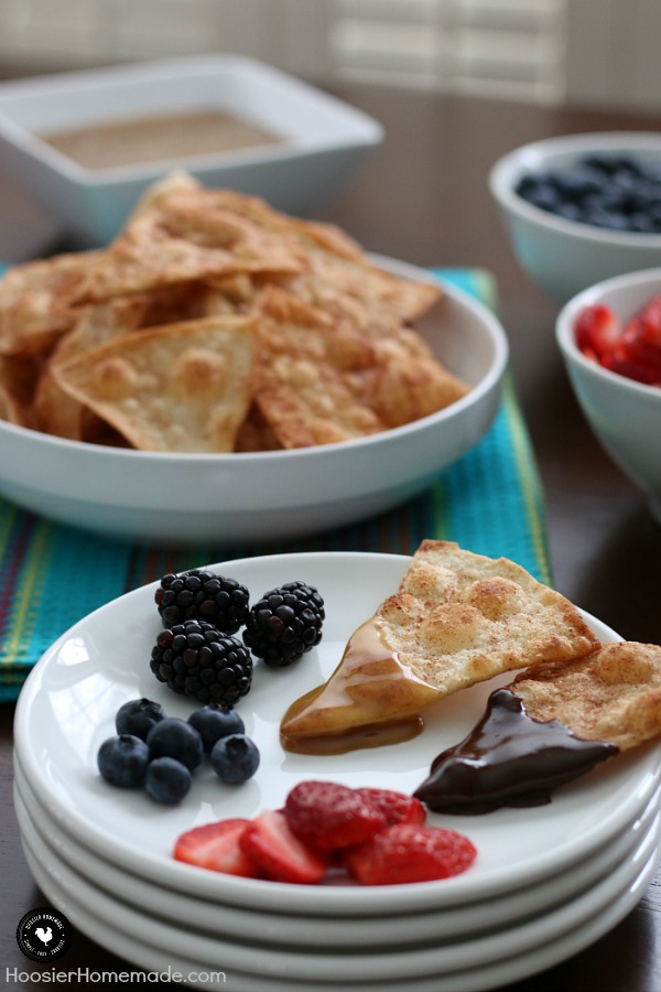 Wow the football fans with this simple and sweet Tortilla Chip Dessert Fondue! The cinnamon and sugar tortilla chips are easy to make and the homemade caramel and Mexican chocolate sends it over the top. Oh and we can't forget the fruit for a little burst of freshness!