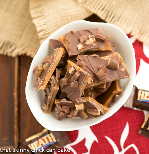 This English Toffee Recipe is topped with chopped nuts and Heath candy bars! Perfect for Holiday Gift Giving! Visit our 100 Days of Homemade Holiday Inspiration for more recipes, decorating ideas, crafts, homemade gift ideas and much more!