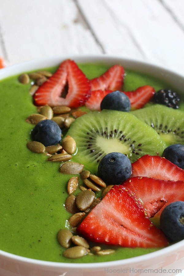 Packed full of flavor and goodness, this Tropical Smoothie Bowl will start your morning off right! Whip up the smoothie in seconds and then add delicious ingredients to the top for a one of a kind breakfast! 