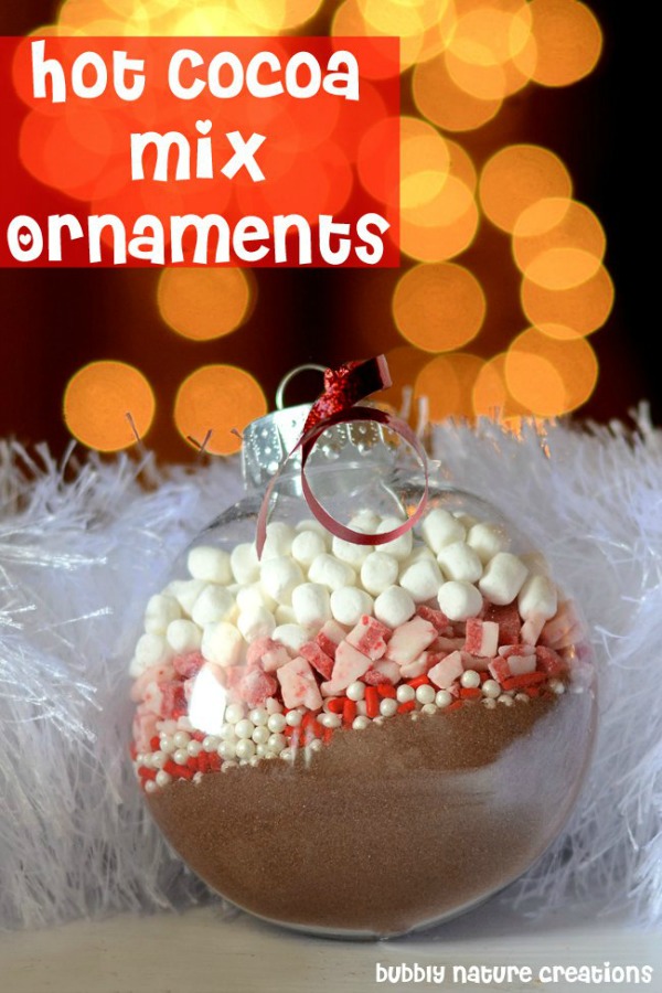 Perfect for gift giving, these Homemade Christmas Ornaments filled with different Hot Cocoa Mixes are EASY to make and inexpensive! Pin this to your Christmas Board!