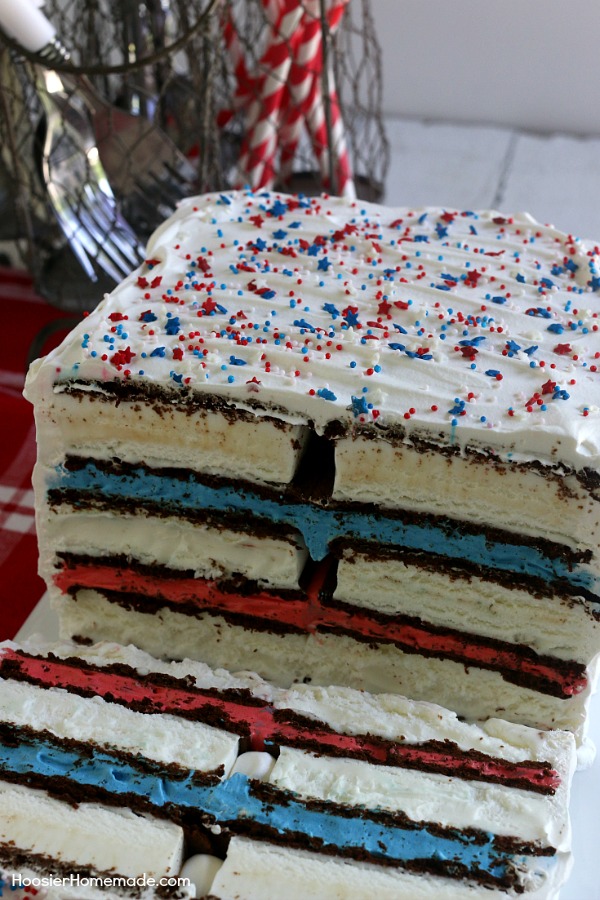 Ice Cream Sandwiches Cake -- this fun red, white and blue ice cream sandwiches cake is super easy and really fun for your 4th of July Celebrations! Just 4 simple ingredients and you have a show-stopping dessert! 