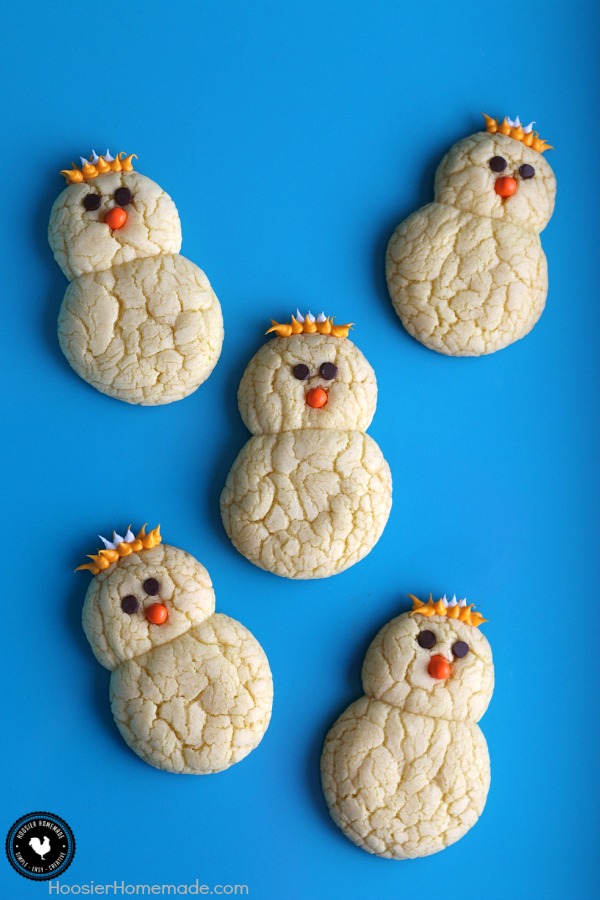 Lemon Chick Peeper Cookies - made with just 3 ingredients plus the face and feathers, these cookies are as fun to make as they are to eat! Perfect for Easter Dessert! Pin to your Recipe Board!