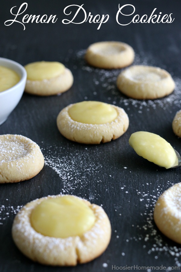 Lemon Drop Cookies - buttery cookies filled with homemade lemon curd! Perfect for Easter Dessert, a Spring treat, and are perfect for a baby or bridal shower! Pin to your Recipe Board!