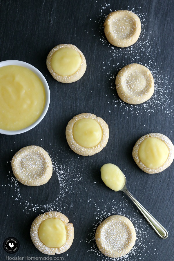 Lemon Drop Cookies - buttery cookies filled with homemade lemon curd! Perfect for Easter Dessert, a Spring treat, and are perfect for a baby or bridal shower! Pin to your Recipe Board!