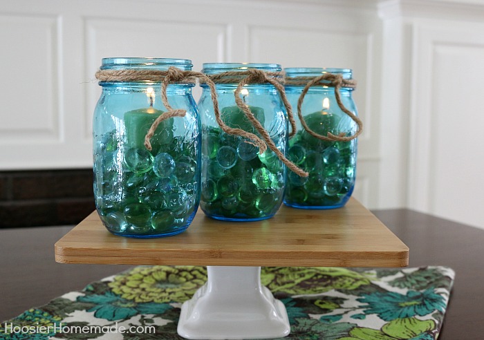 Blue Mason Jars filled with stones and candles