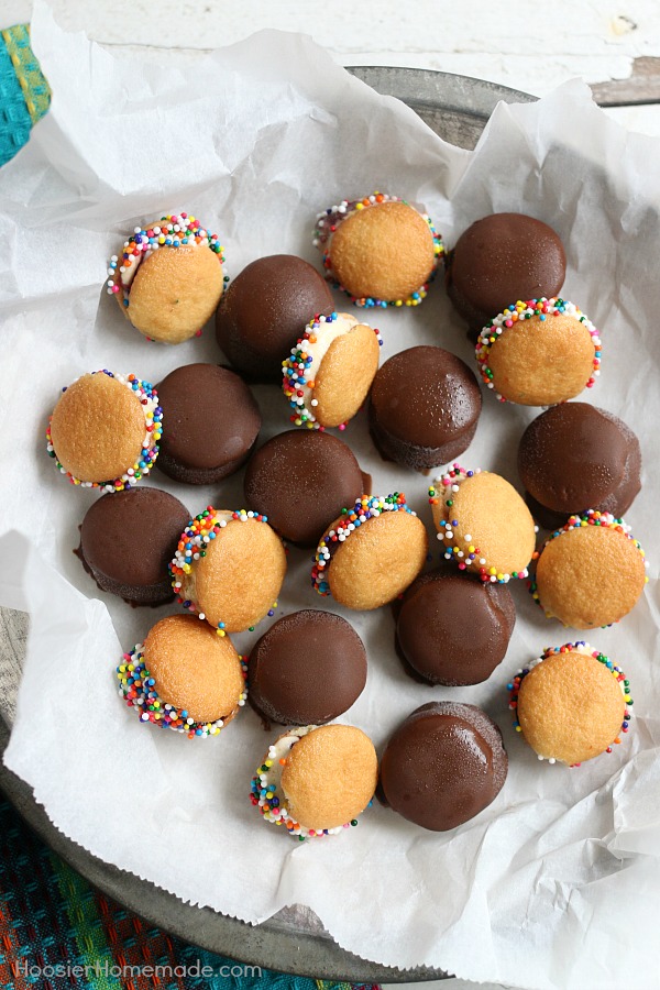 MINI ICE CREAM SANDWICHES -- These bite-size ice cream sandwiches can be put together in minutes! Kids of ALL ages will love them! Dip in chocolate coating, add sprinkles or leave plain! 