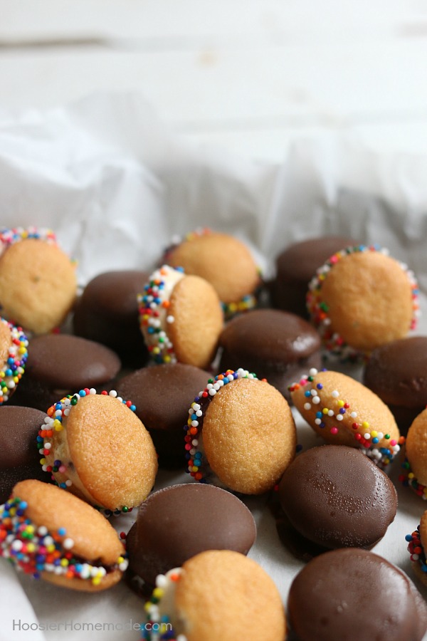 MINI ICE CREAM SANDWICHES -- These bite-size ice cream sandwiches can be put together in minutes! Kids of ALL ages will love them! Dip in chocolate coating, add sprinkles or leave plain! 