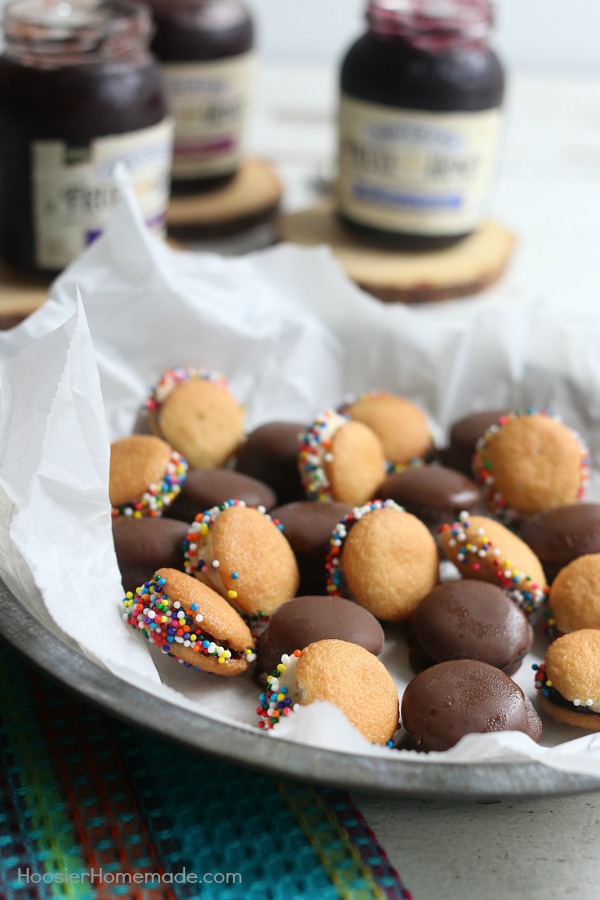 MINI ICE CREAM SANDWICHES -- These bite-size ice cream sandwiches can be put together in minutes! Kids of ALL ages will love them! Dip in chocolate coating, add sprinkles or leave plain! 