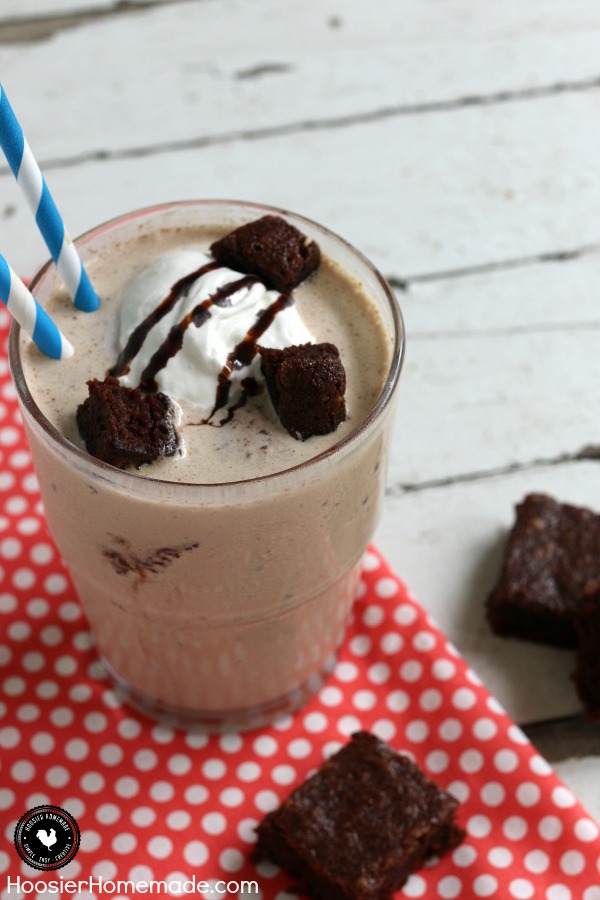 Mocha Brownie Shake - luscious, refreshing shake made with Mocha Iced Coffee, Ice Cream and Brownies - YUM! Top with a dollop of whipped topping, drizzle of chocolate syrup and a few brownie chunks and you have a delicious treat to enjoy at home! Be sure to save the recipe by pinning to your Recipe Board!