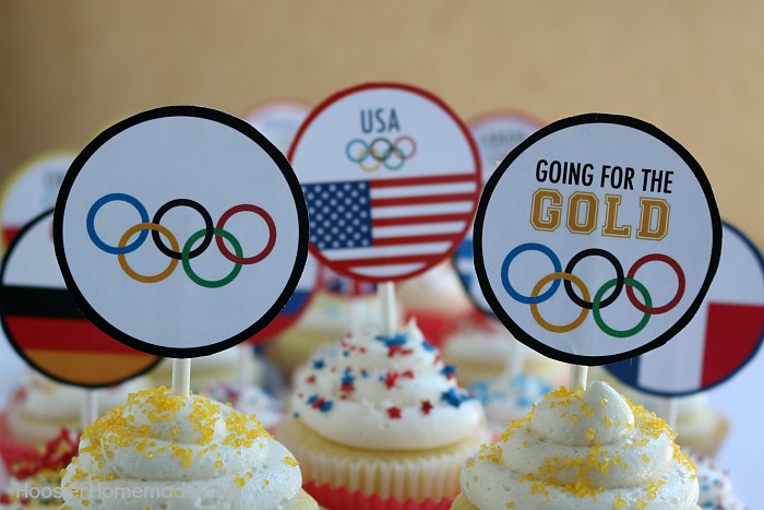 OLYMPIC CUPCAKE TOPPERS -- Celebrate the Olympic Games with these FREE PRINTABLE CUPCAKE TOPPERS! The kids will get a little history lesson with these World Flag Toppers! 