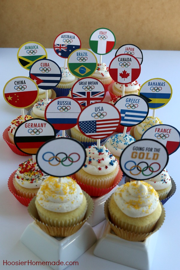 OLYMPIC CUPCAKE TOPPERS -- Celebrate the Olympic Games with these FREE PRINTABLE CUPCAKE TOPPERS! The kids will get a little history lesson with these World Flag Toppers! 