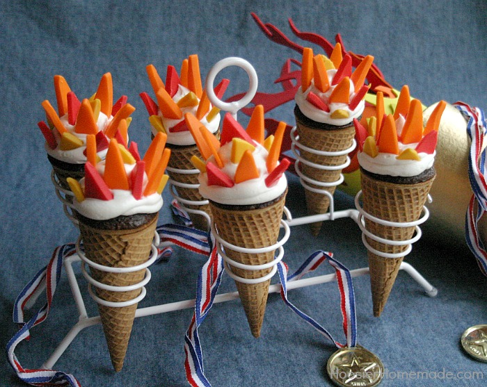 OLYMPIC TORCH CUPCAKES -- Celebrate the Olympics will these fun to make Torch Cupcakes! The flames are made with Candy Clay, it's like fondant, but taste a LOT better! 