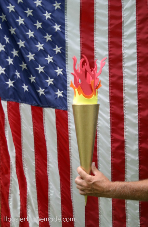 DIY OLYMPIC TORCH - Celebrate the Olympic Games with this fun Olympic Torch! The kids can help make it too! Use it for your Backyard Olympic Games! 