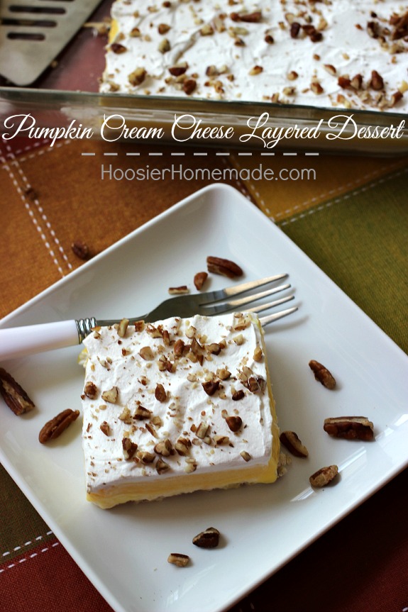 Pumpkin Cream Cheese Layered Dessert | Layers of cream cheese, whipped topping, pudding, and pecans on top of a sweet crust | Recipe on HoosierHomemade.com