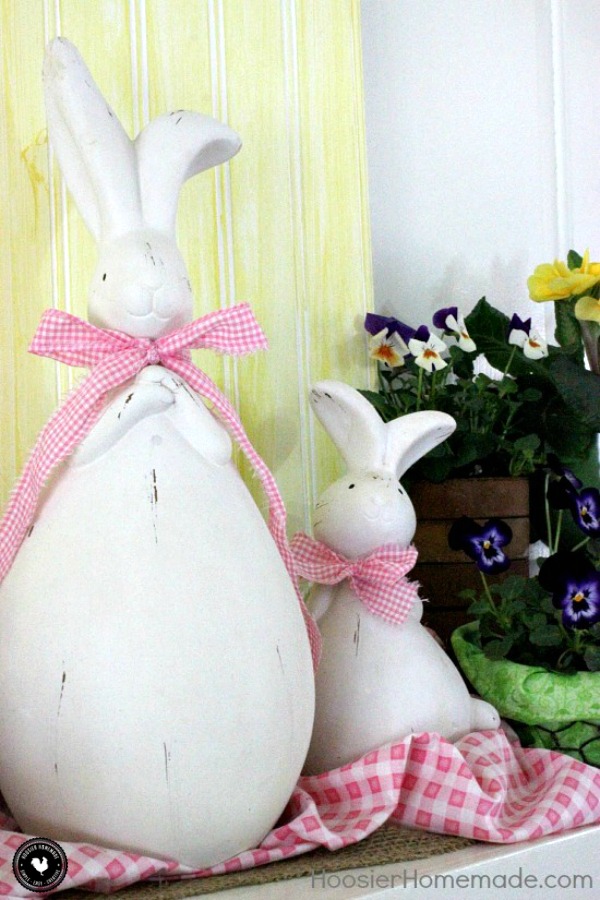 Brighten your Spring Mantel with these easy ideas! Add a bit of color with fresh plants! And a bit of whimsy with cute bunnies! Pin to your Decorating Board!