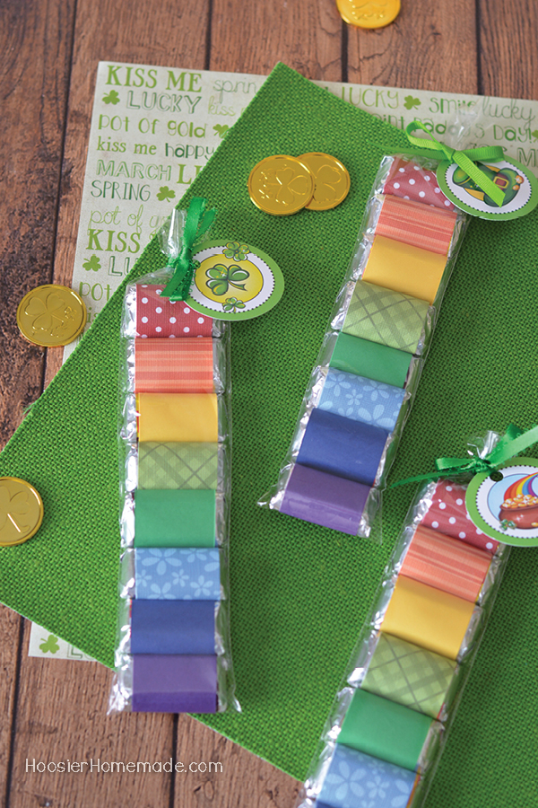 St. Patrick's Day Candy Wrapper - create a fun little treat for St. Patrick's Day with these candy bars wrapped in rainbow colors and tied with a FREE Printable St. Patrick's Day Tag! 