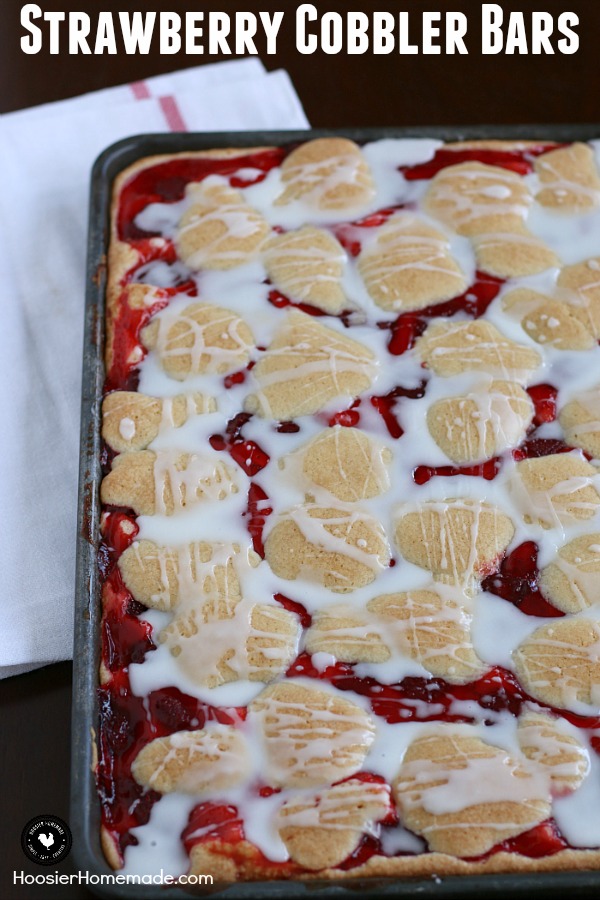 These Strawberry Cobbler Bars will knock your socks OFF! They are super simple to make and taste amazing! Serve them for any occasion, take them to a potluck or easy enough for a weeknight dessert! 