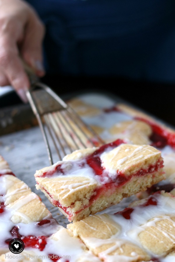 These Strawberry Cobbler Bars will knock your socks OFF! They are super simple to make and taste amazing! Serve them for any occasion, take them to a potluck or easy enough for a weeknight dessert! 