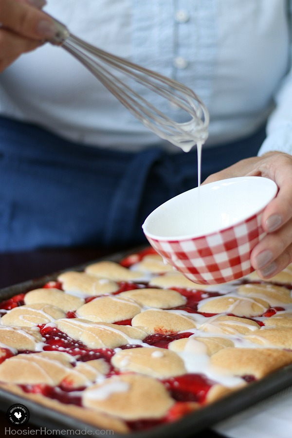 These Strawberry Cobbler Bars will knock your socks OFF! They are super simple to make and taste amazing! Serve them for any occasion, take them to a potluck or easy enough for a weeknight dessert! 