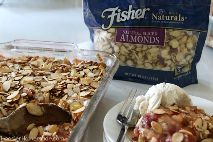 Strawberry Rhubarb Almond Crumble Dessert - simple ingredients + NO mixing for this delicious recipe! The tartness of the rhubarb and the sweetness of the strawberries combined with crushed pineapple send this easy to make dessert over the top! Be sure to save the recipe by pinning to your Recipe Board!