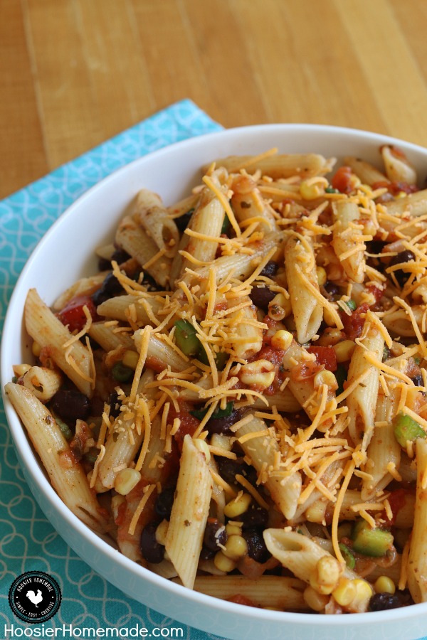 A simple Pasta Salad Recipe filled with your favorite Taco flavors! And bonus - it's healthy too! This Taco Pasta Salad is perfect for potlucks, picnics or for a side dish on Taco Night! Pin to your Recipe Board!