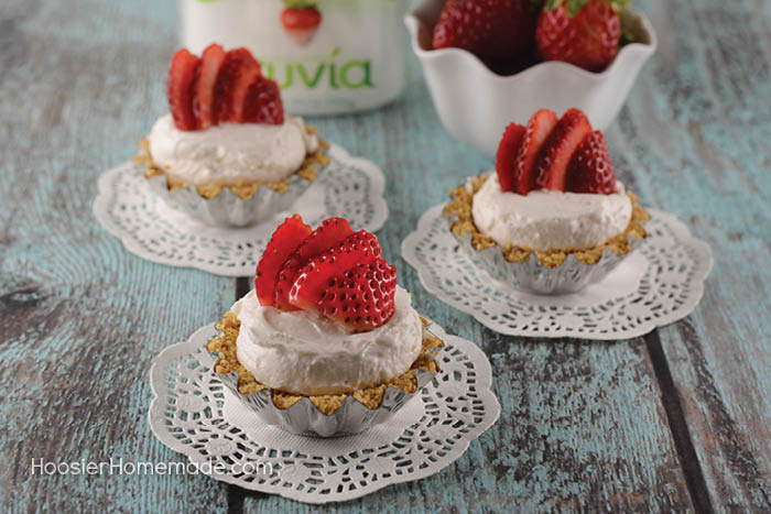 These Easy Mini Strawberry Cheesecakes are as fun to make as they are to eat. Perfect for any occasion! Impress your family and friends - SHH don't tell them they are super easy!