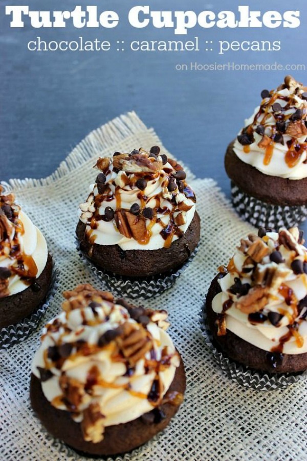 Chocolate Turtle Cupcakes topped with Caramel Buttercream Frosting, drizzled with Caramel Topping and Hot Fudge, then sprinkled with mini chocolate chips and chopped pecans! Stop drooling! Pin to your Recipe Board!