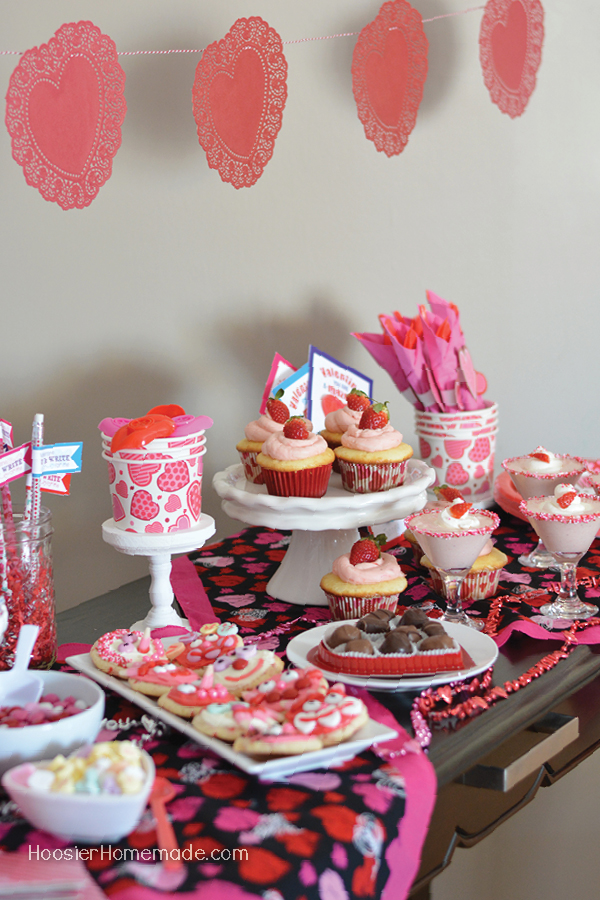 Put together this budget friendly Valentine's Day Party for Kids that they will remember for years. Treats, decorations, party favors and more!