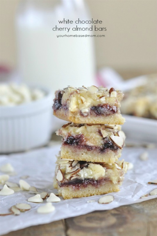 Layers of goodness! These White Chocolate Cherry Almond Bars are filled with cherry preserves, almonds and white chocolate chips! Visit our 100 Days of Homemade Holiday Inspiration for more recipes, decorating ideas, crafts, homemade gift ideas and much more!