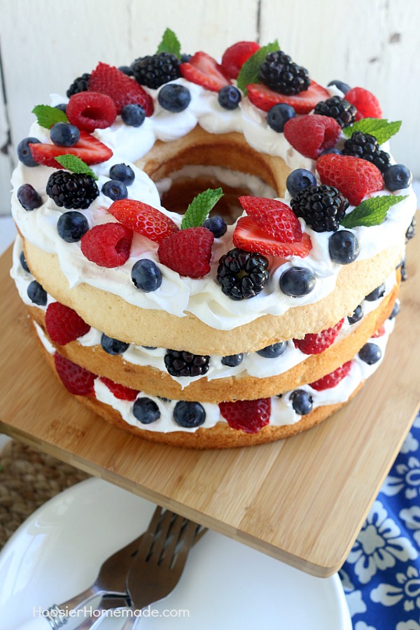 This showstopping Angel Food Cake with Berries takes ONLY 15 minutes to put together! WOW your guests with this amazing and delicious 4th of July Cake Idea or serve for any occasion! 