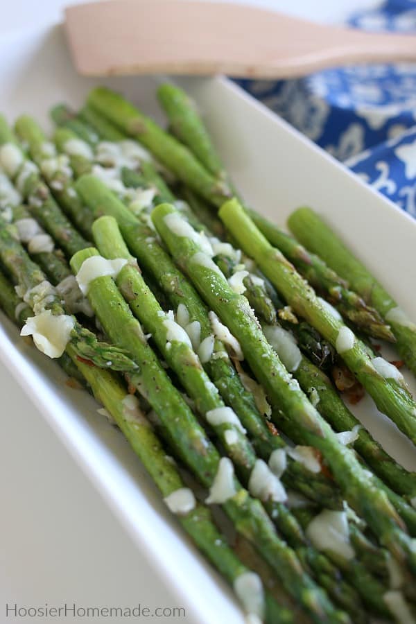 Baked Asparagus with Garlic and Cheese on serving plate