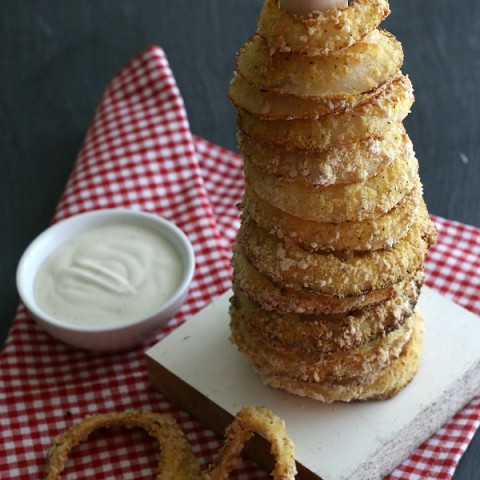Oven Baked Onion Rings Recipe - No need to sacrifice the taste for a healthier version! These Onion Rings are easy to make and have less calories than fried! AND are Dairy Free! Whip up a batch for your next party, tailgating, game night and more!
