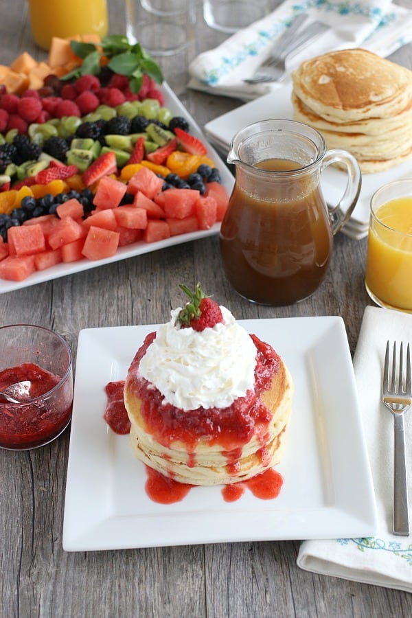 Buttermilk Pancakes with strawberries and whip cream