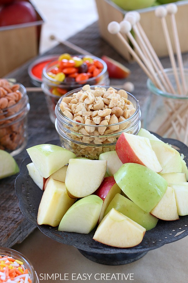 Apples cut with toppings for caramel apples