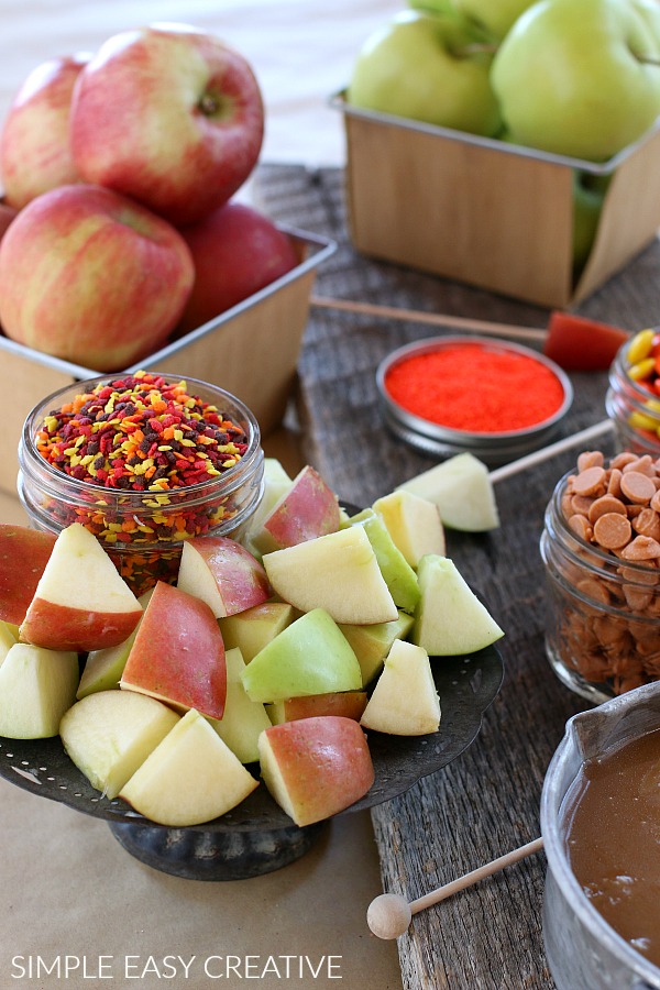 Apples with caramel and toppings for caramel apple fondue