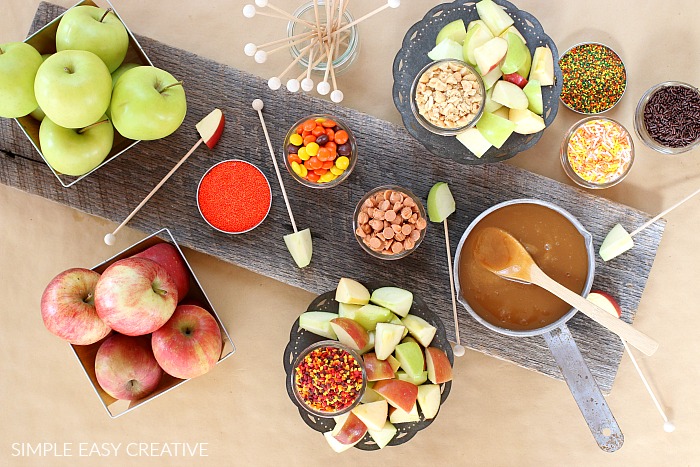 Caramel with apples and toppings on board